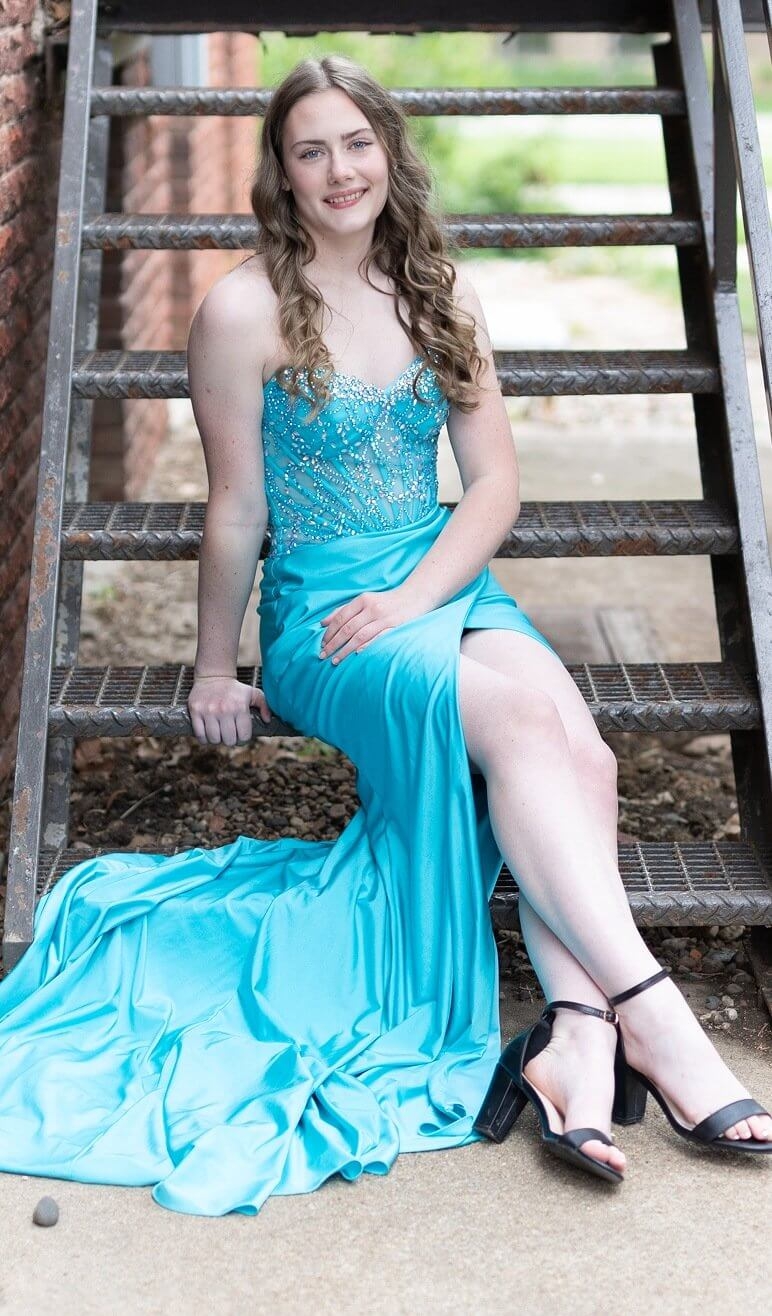 Сouple wearing a white gown and a black suit