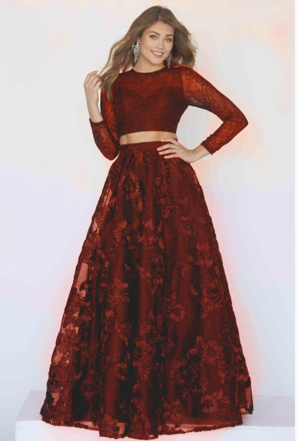 model wears two-piece burgundy dress with long sleeves