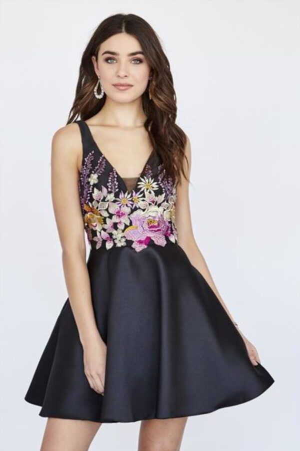 Model wears black dress with flowers on front