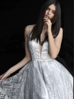 Dark-haired model wears glittery silver dress