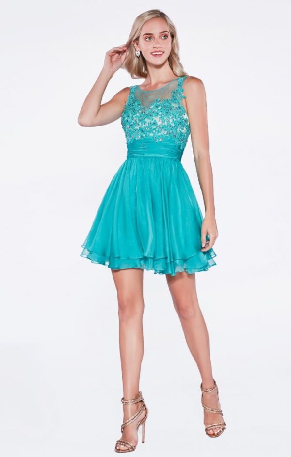 Model wears turquoise shot dress