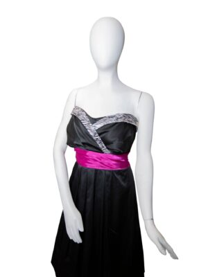 Strapless black dress with pink waist on mannequin