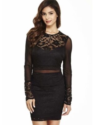 Model wears lacy black dress with long sleeves