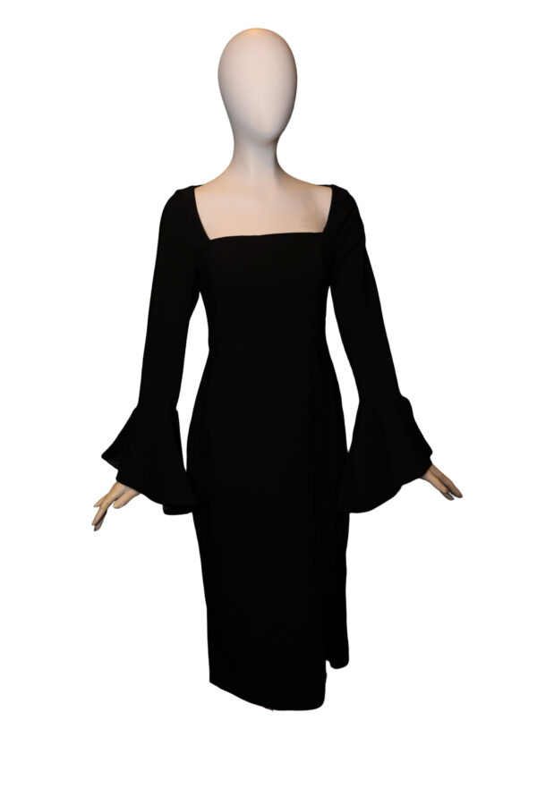 mannequin wears black dress with long sleeves
