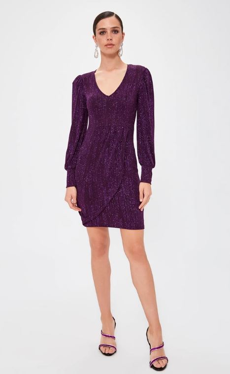 Model wears long-sleeved purple dress