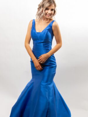 model wears royal blue gown
