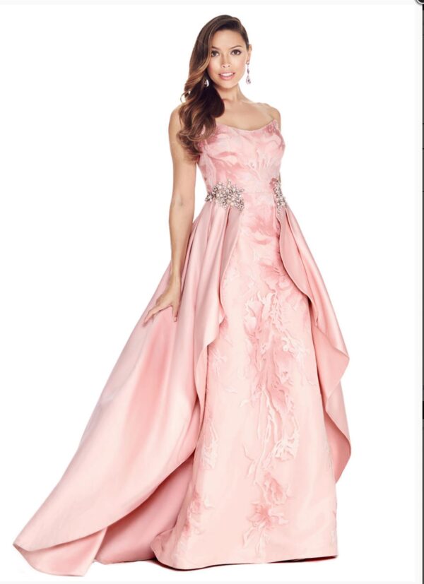 Model wears pink brocade dress