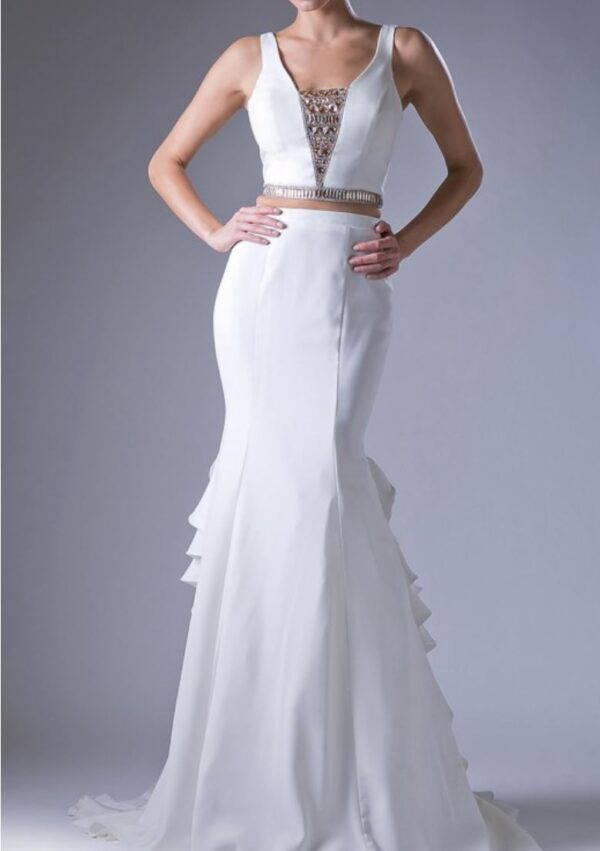 Model wears two-piece ivory gown