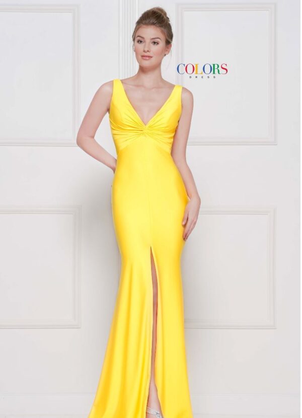 Model wears yellow dress with front slit
