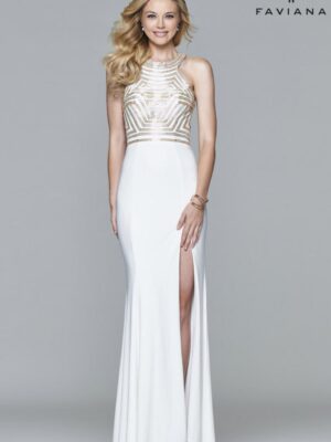 Model wears white gown with slit and gold adornment