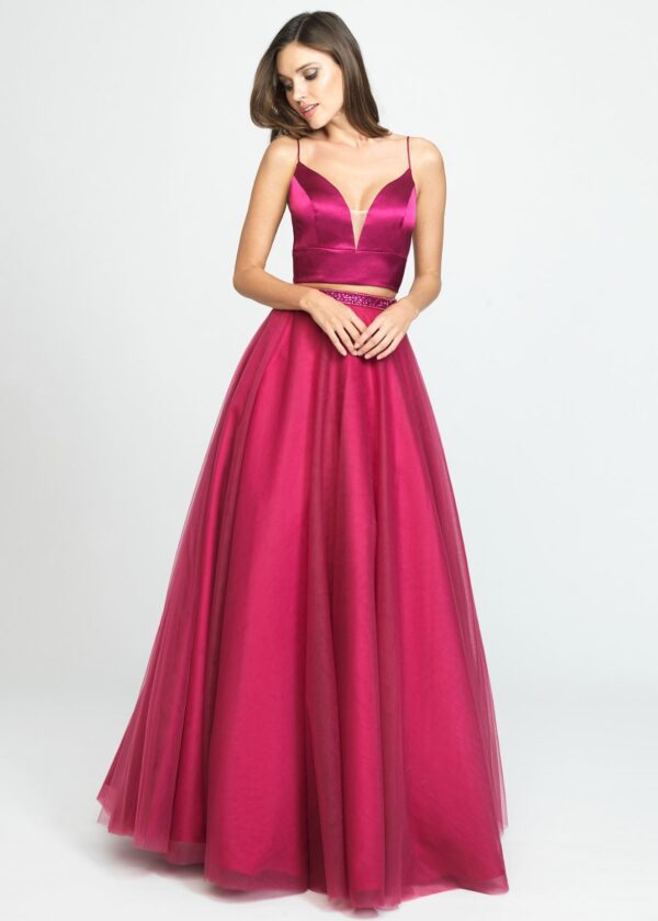 Model wears wine-colored two-piece ballgown