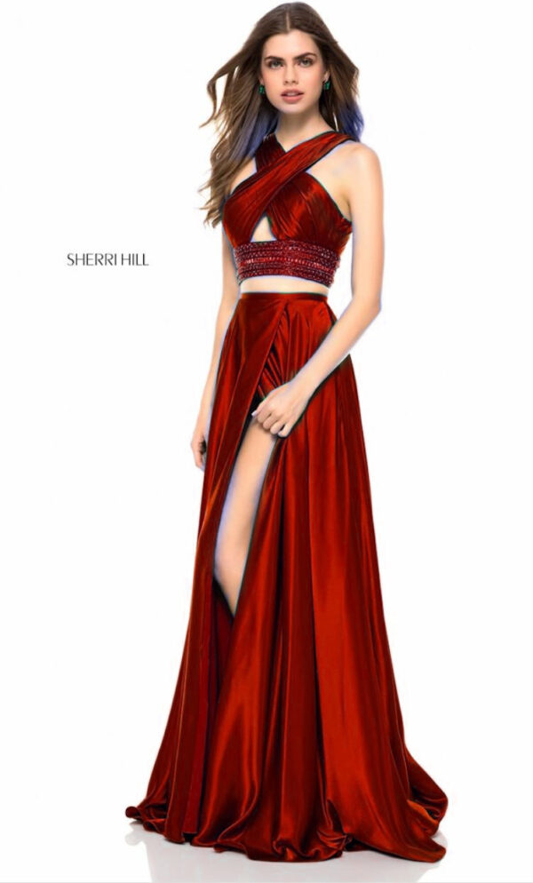 model wears two-piece red gown