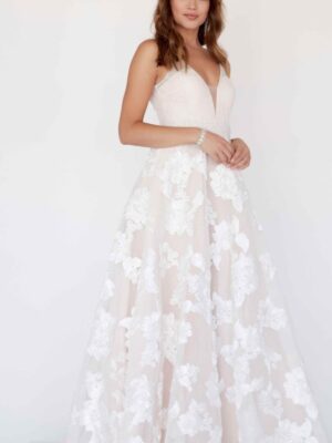 model wears cream-colored dress