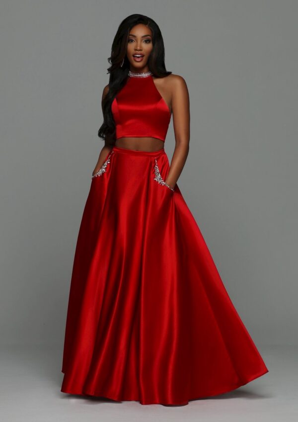 Model wears two-piece red dress