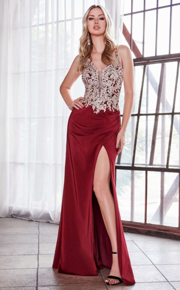model wears burgundy lace gown