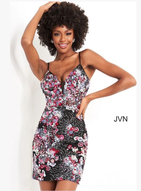 model wears sequined floral print short dress