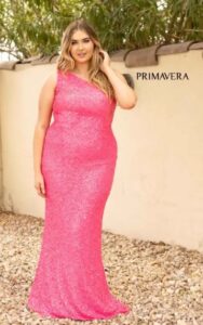 plus size gown in neon pink on model